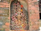 Kathmandu Changu Narayan 10-1 10 Headed And 10-Armed Vishnu Stone Statue With Another Vishnu Below Lying On Serpent Ananta A small black slab from 5C or 6C at Changu Narayan has a 10-headed and 10-armed standing Vishnu, with another Vishnu reclining on the serpent Ananta below. The scenes are divided into three sections � the heavens, the world of men, and the underworld below.